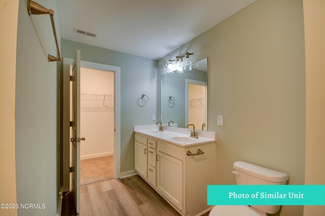 bathroom featuring a shower and hardwood / wood-style floors