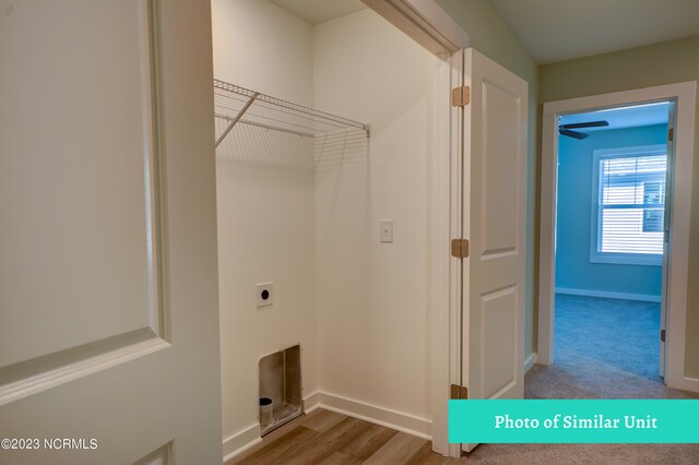 unfurnished bedroom with ceiling fan and light colored carpet