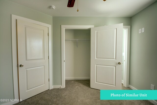 hallway featuring light carpet