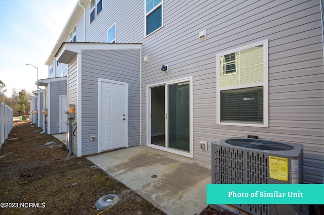 exterior space with central AC and a patio area