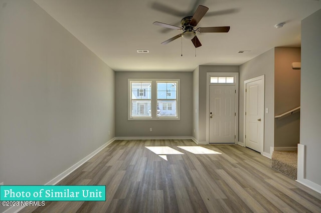 entrance foyer with ceiling fan and light wood-type flooring