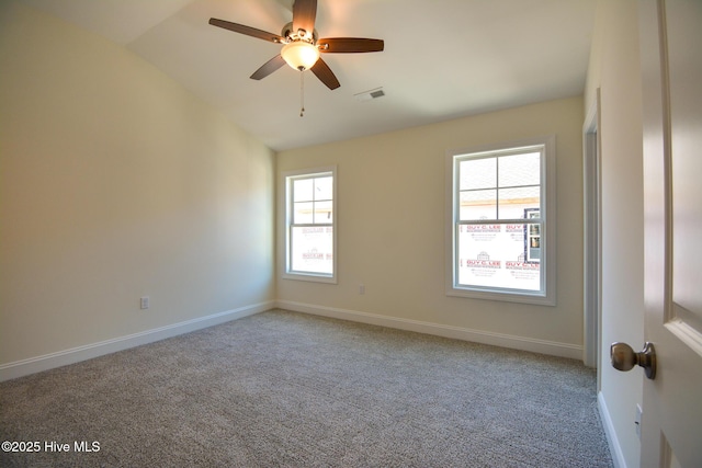 carpeted empty room with lofted ceiling and ceiling fan