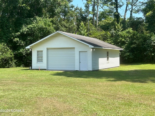 garage with a yard