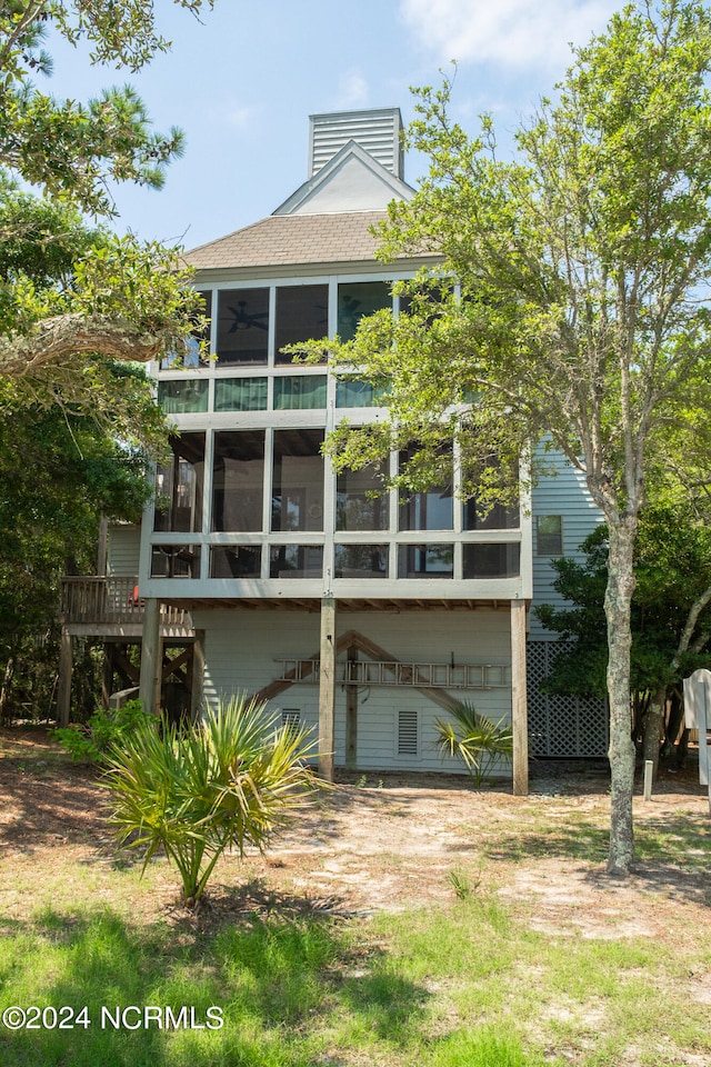 back of property featuring a sunroom