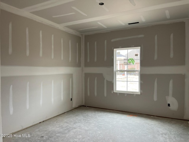 unfurnished room featuring visible vents