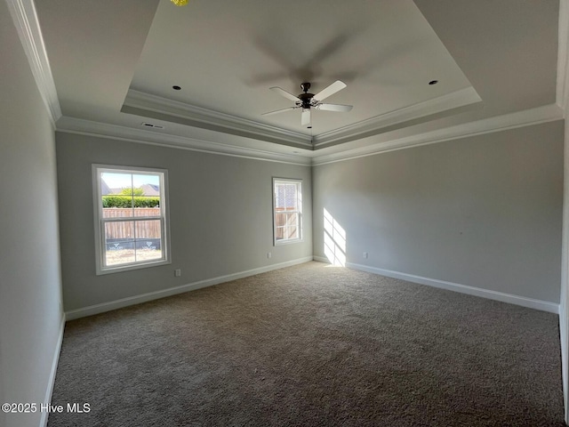 1254 Palatka Pl SE, Bolivia, NC 28422 - spare room featuring a raised ceiling, a ceiling fan, ornamental molding, baseboards, and carpet flooring
