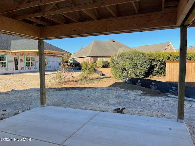 view of patio / terrace featuring fence