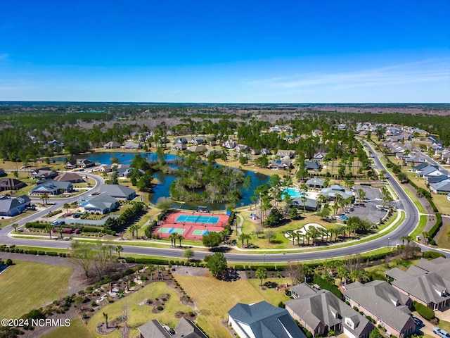 drone / aerial view with a water view and a residential view