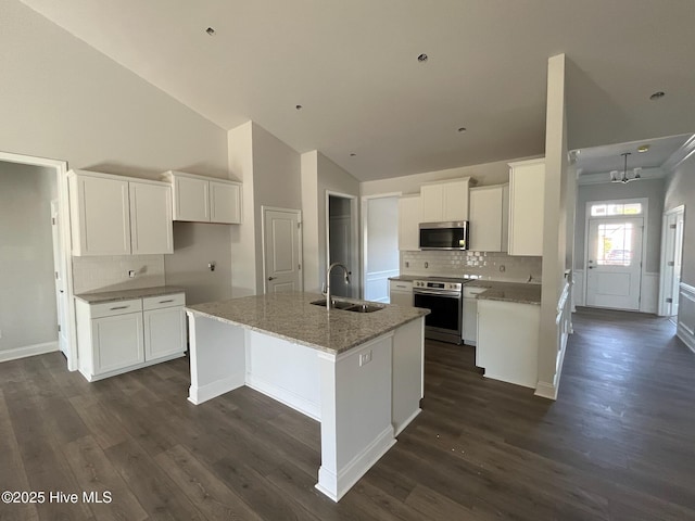 1254 Palatka Pl SE, Bolivia, NC 28422 - kitchen featuring a sink, appliances with stainless steel finishes, backsplash, a kitchen island with sink, and high vaulted ceiling