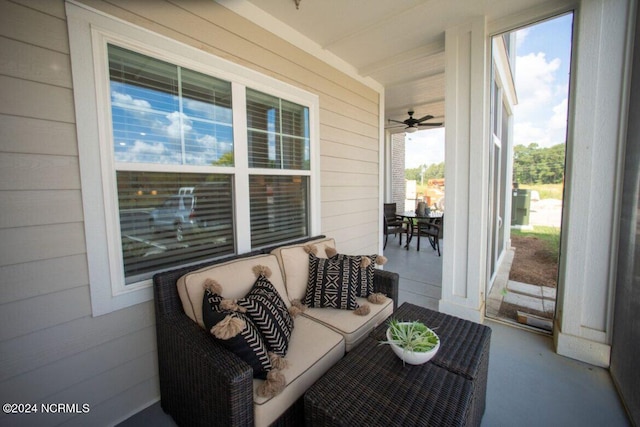 sunroom featuring ceiling fan