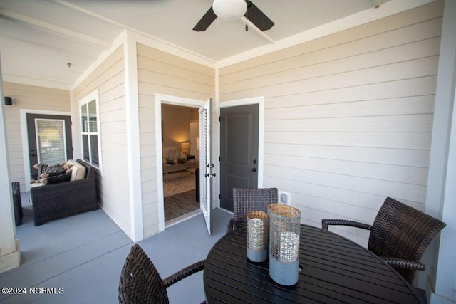 view of patio featuring ceiling fan