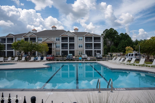 view of swimming pool with a patio area