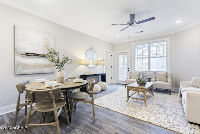 living room with crown molding, dark hardwood / wood-style floors, and ceiling fan