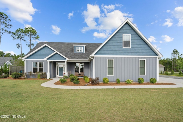 view of front of home featuring a porch and a front lawn