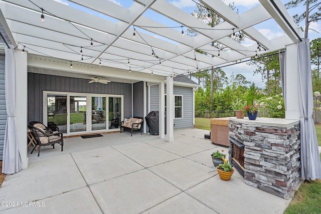 view of patio / terrace with a pergola, ceiling fan, area for grilling, and exterior kitchen