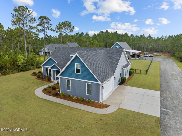 view of front of home featuring a garage and a front yard