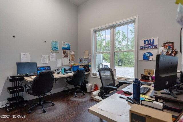 office space featuring hardwood / wood-style floors and a high ceiling