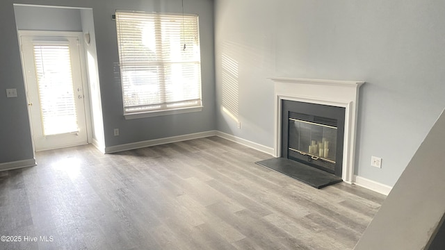 unfurnished living room featuring light hardwood / wood-style floors