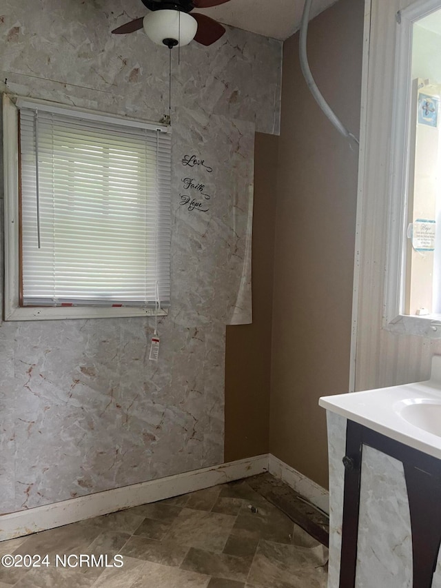 bathroom featuring ceiling fan and vanity