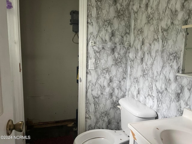 bathroom featuring vanity and toilet