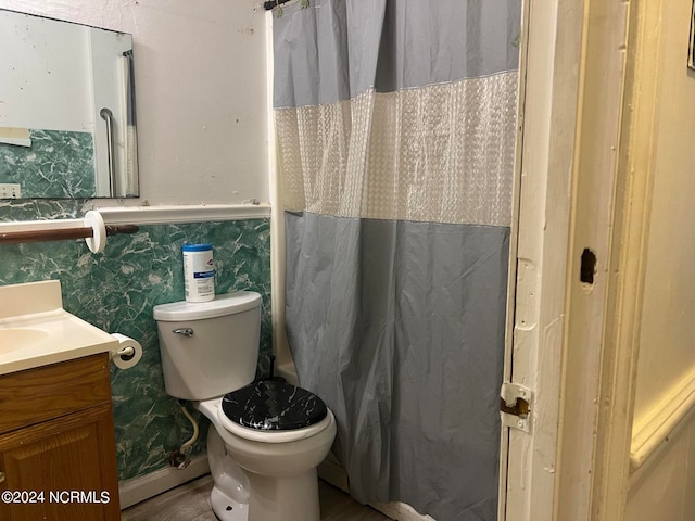 bathroom featuring toilet and vanity