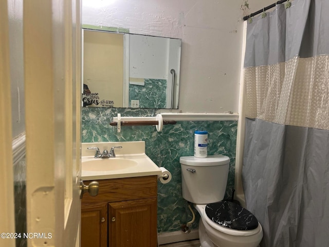 bathroom featuring toilet and vanity