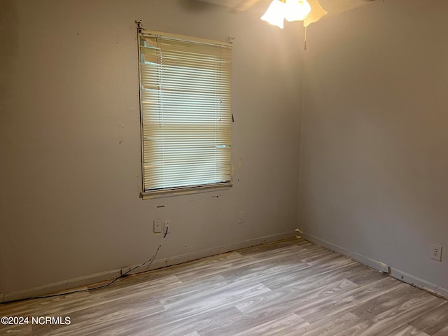 spare room featuring light hardwood / wood-style floors