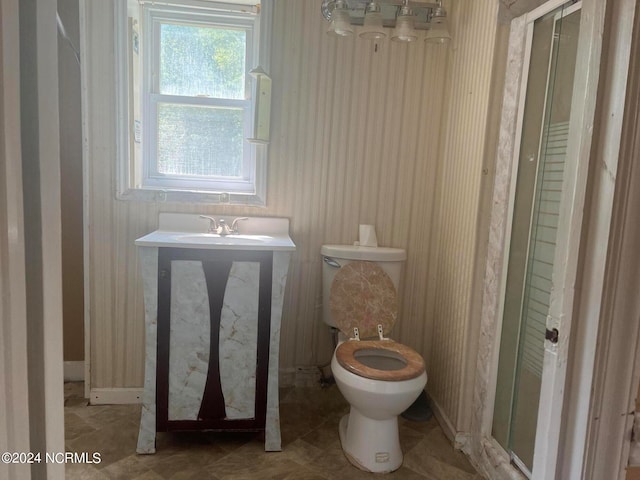 bathroom with a shower and toilet