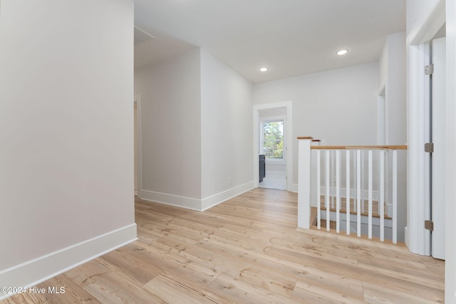 115 Seagate Pl, Wilmington, NC 28403 - corridor featuring baseboards, wood finished floors, recessed lighting, and an upstairs landing