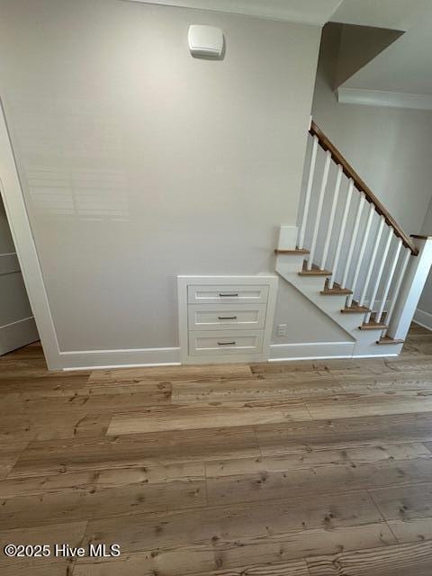 115 Seagate Pl, Wilmington, NC 28403 - stairway with hardwood / wood-style flooring, baseboards, and crown molding