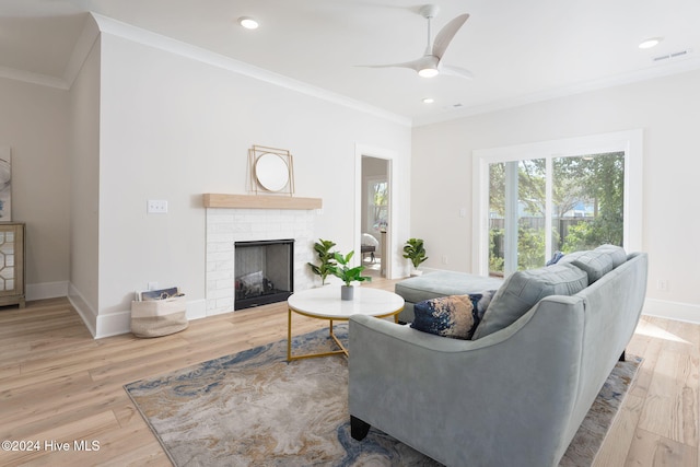 115 Seagate Pl, Wilmington, NC 28403 - living room featuring ornamental molding, ceiling fan, a fireplace, wood finished floors, and baseboards