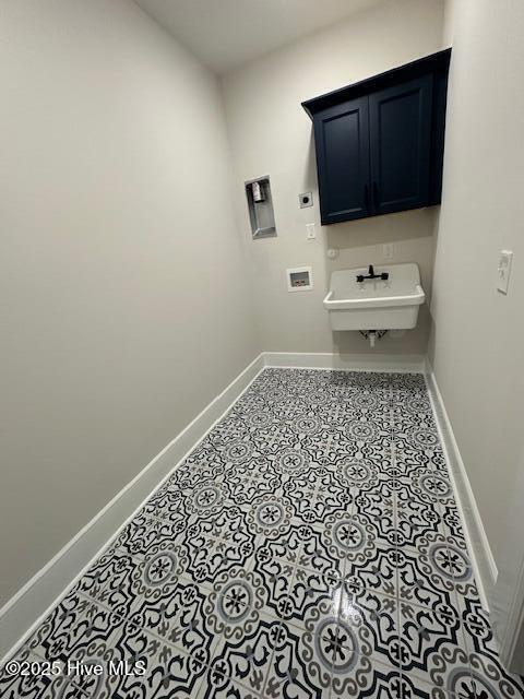 115 Seagate Pl, Wilmington, NC 28403 - laundry room with electric dryer hookup, baseboards, hookup for a washing machine, and cabinet space
