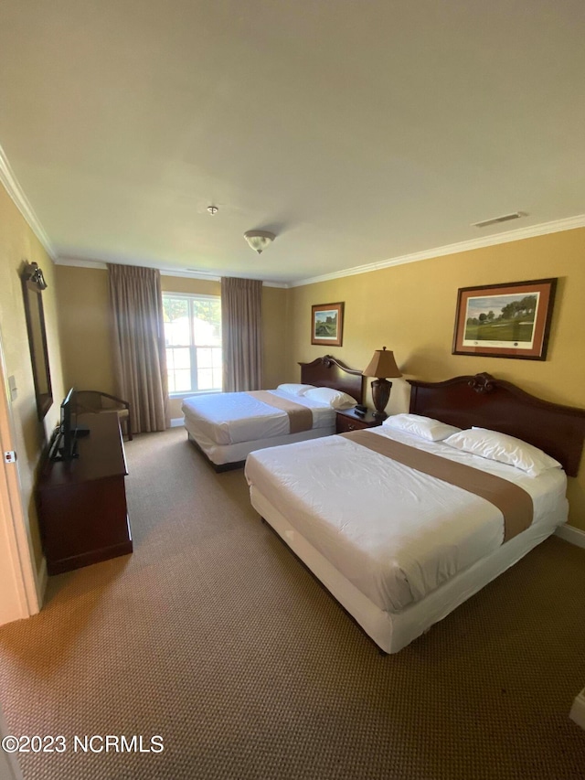 bedroom with carpet and crown molding