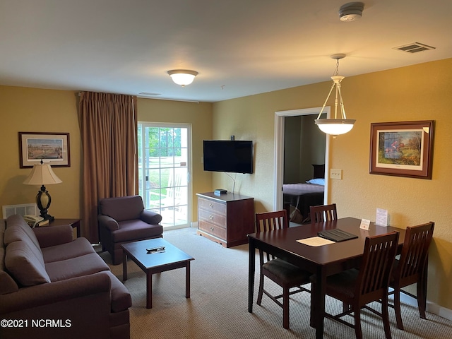 dining space featuring carpet floors