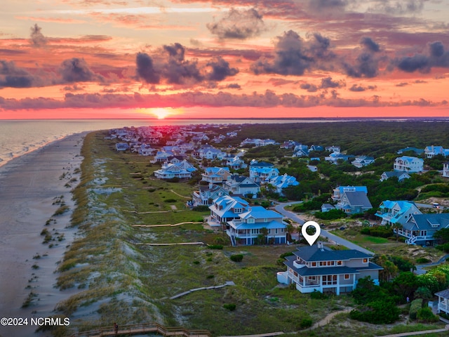 aerial view at dusk with a water view