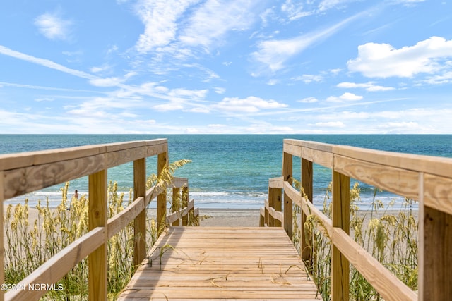 view of home's community with a water view