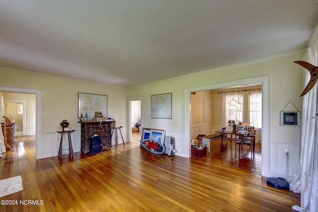 miscellaneous room with hardwood / wood-style flooring and crown molding