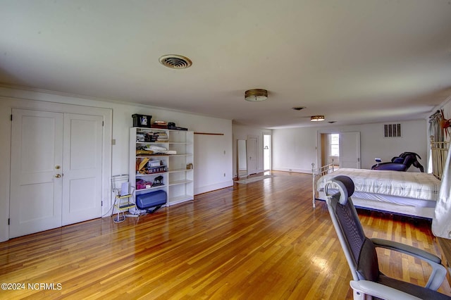 bedroom with light hardwood / wood-style flooring