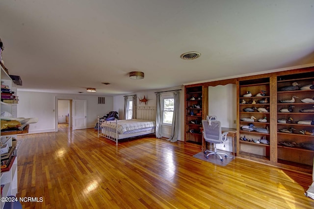 bedroom with hardwood / wood-style floors