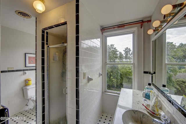 264 Main St, Swanquarter, NC 27885 - bathroom with a shower stall, toilet, visible vents, and tile walls