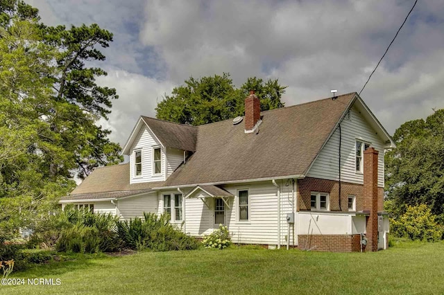 back of house with a yard