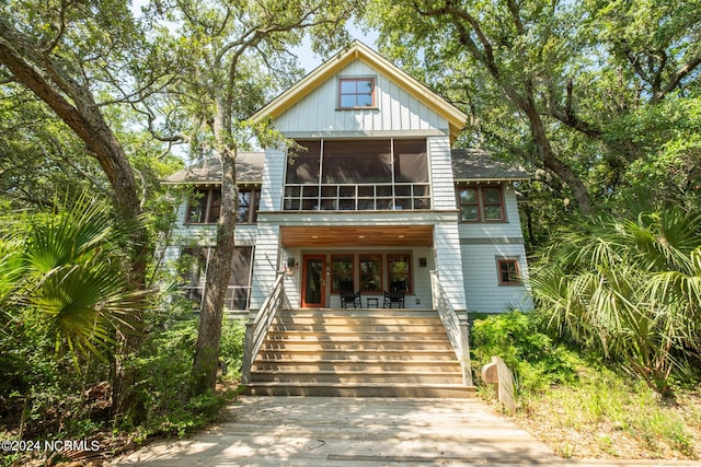 view of front of home with a sunroom