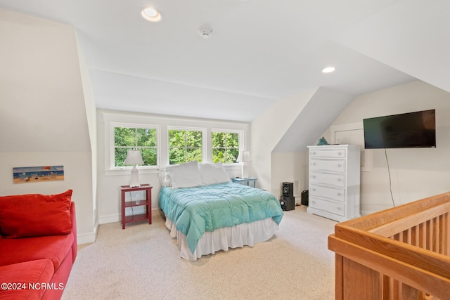 carpeted bedroom with vaulted ceiling