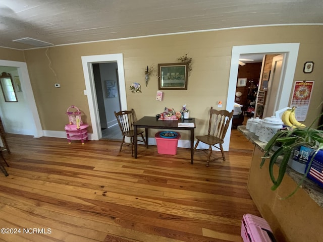 dining room with wood-type flooring