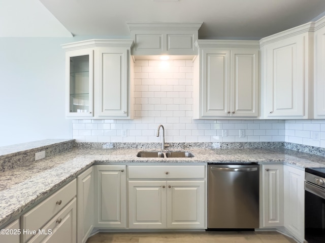 244 Grandview Dr, Sneads Ferry, NC 28460 - kitchen featuring backsplash, a sink, white cabinets, and appliances with stainless steel finishes
