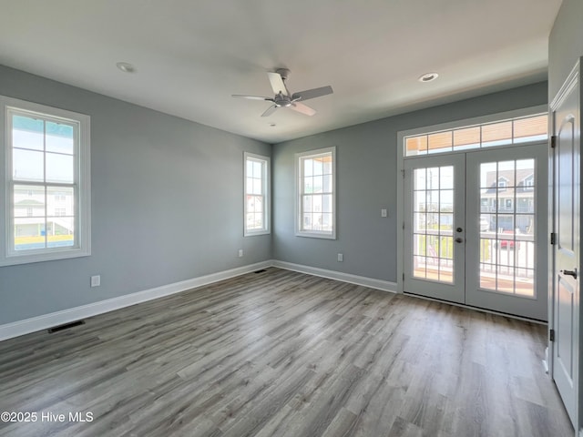 244 Grandview Dr, Sneads Ferry, NC 28460 - spare room featuring wood finished floors, visible vents, plenty of natural light, and a ceiling fan