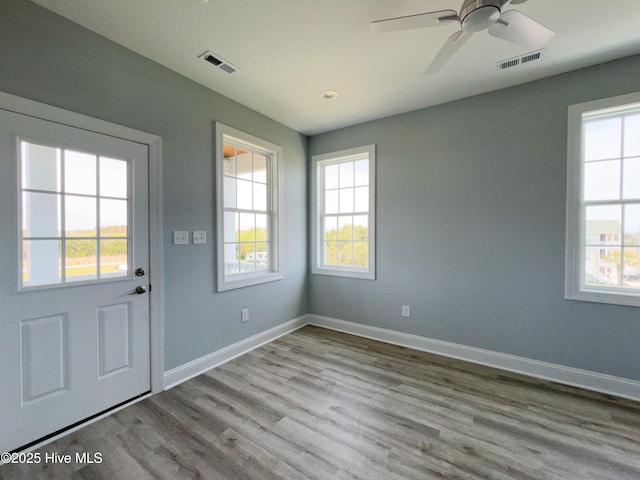 244 Grandview Dr, Sneads Ferry, NC 28460 - entryway with baseboards, visible vents, wood finished floors, and ceiling fan