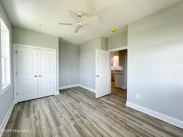 244 Grandview Dr, Sneads Ferry, NC 28460 - unfurnished bedroom featuring baseboards, recessed lighting, wood finished floors, and a closet