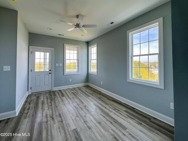 244 Grandview Dr, Sneads Ferry, NC 28460 - unfurnished room with baseboards, visible vents, wood finished floors, and a ceiling fan
