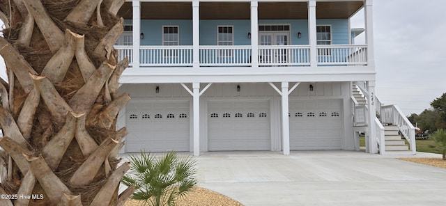 244 Grandview Dr, Sneads Ferry, NC 28460 - view of front of house featuring stairway, an attached garage, and driveway